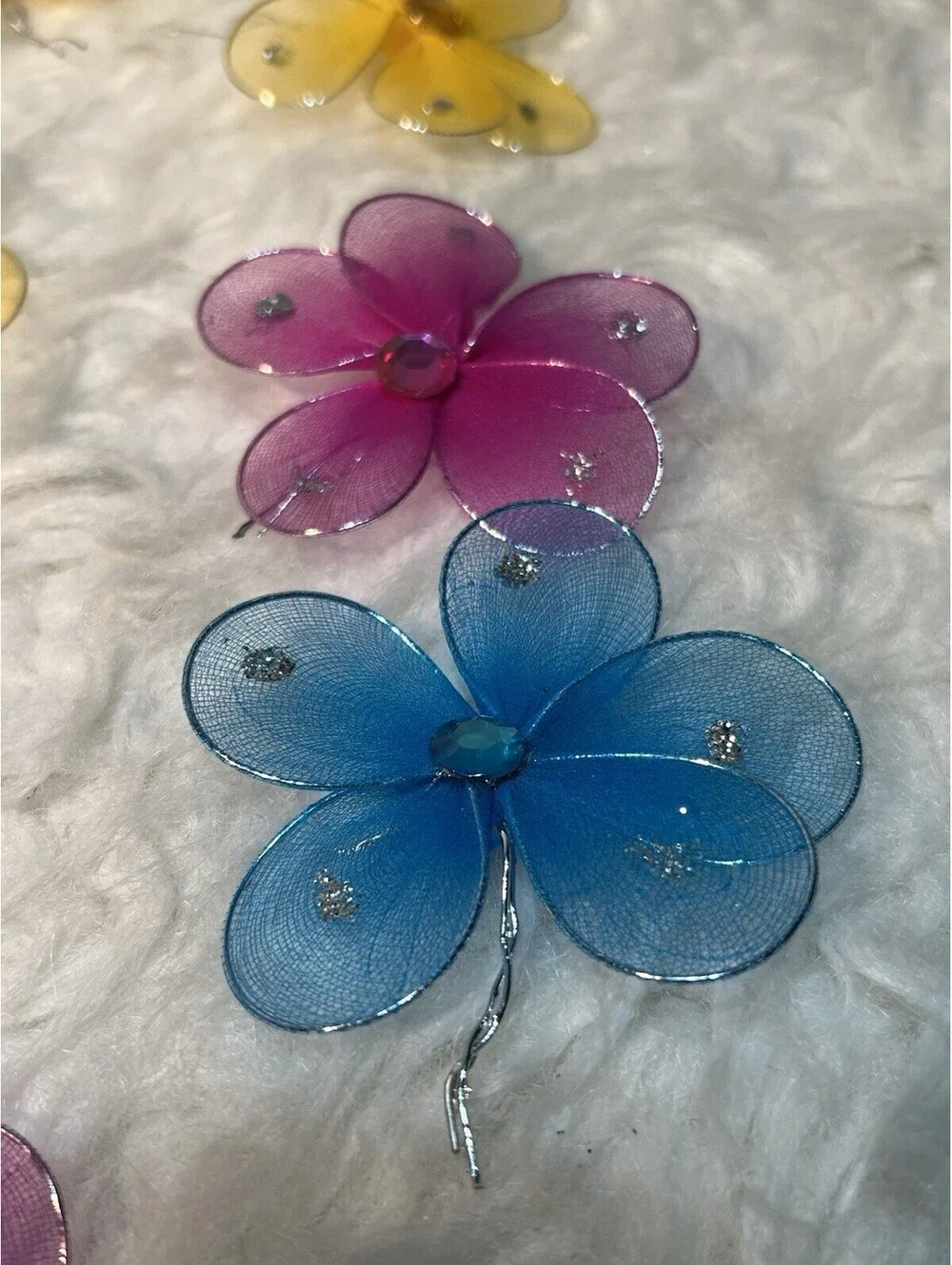 Lot of multicolored sparkling mesh and rhinestone flowers